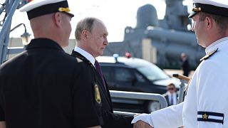 Russia scales down celebrations honoring its navy as Ukraine launches more drone attacks