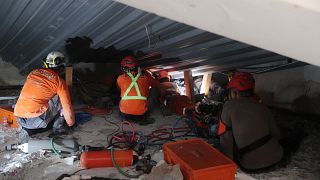 Rescue teams search for survivors after school building collapse in Indonesia