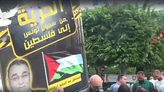 Tunisians protest against president on anniversary of his power grab