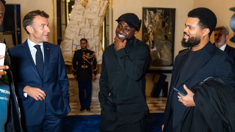 French President Emmanuel Macron -L ,  Nigerian musician Davido-M 