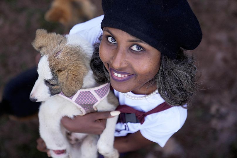 Feven Melese holds a dog that was abandoned on the streets of the capital, Addis Ababa, Ethiopia, 7 September 2025 